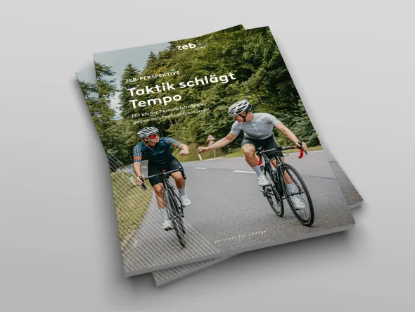 two people riding bicycles on a road two people riding bicycles on a road