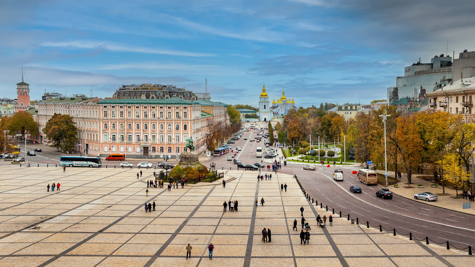 a large square with people walking on it a large square with people walking on it